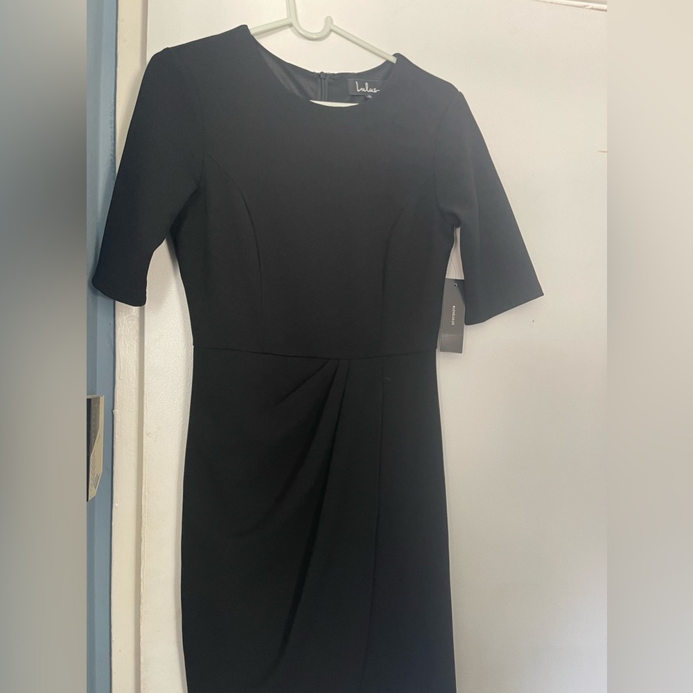 Black fully lined dress tags still on. Never worn